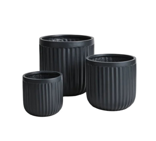 Three black textured planters of different sizes on a light gray background